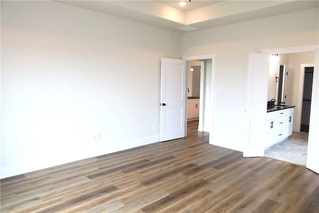 1977 Cambria Dr, Bryan, TX 77807 - unfurnished bedroom with light wood finished floors and a sink