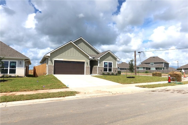 1977 Cambria Dr, Bryan, TX 77807 - craftsman inspired home with board and batten siding, concrete driveway, and a garage