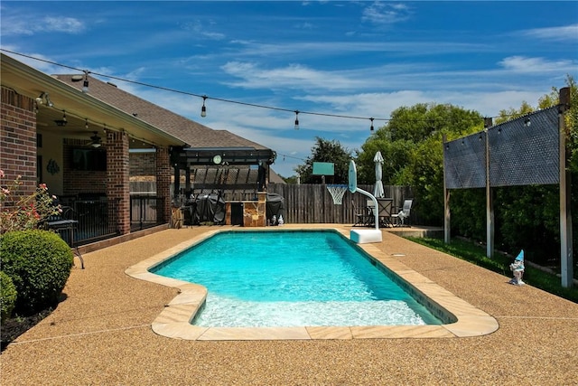 view of pool featuring a patio area and ceiling fan