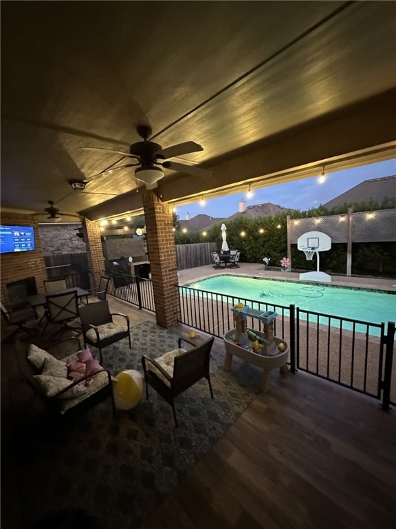 view of swimming pool featuring a mountain view and a patio area