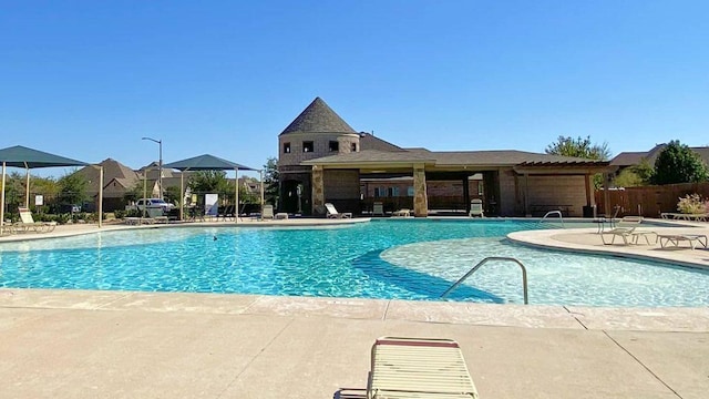 view of swimming pool featuring a patio area