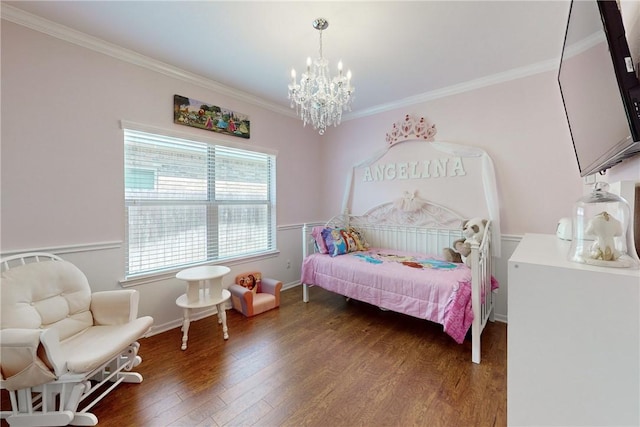 bedroom with dark hardwood / wood-style flooring, a chandelier, and ornamental molding