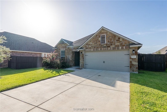 view of front facade featuring a garage and a front yard