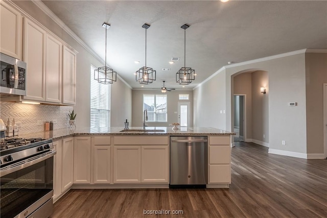 5007 Maroon Creek Dr, Bryan, TX 77802 - kitchen with ceiling fan, sink, white cabinets, and stainless steel appliances