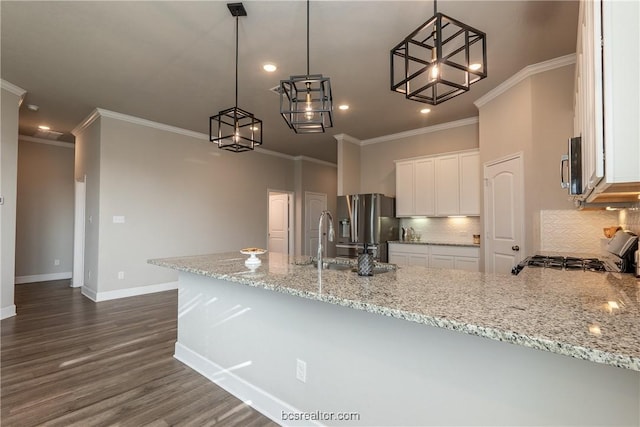 5007 Maroon Creek Dr, Bryan, TX 77802 - kitchen with white cabinetry, sink, light stone counters, kitchen peninsula, and pendant lighting