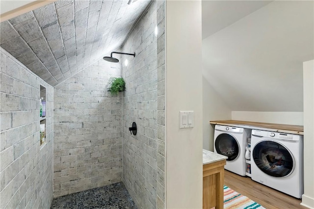 laundry room with light wood-type flooring and separate washer and dryer