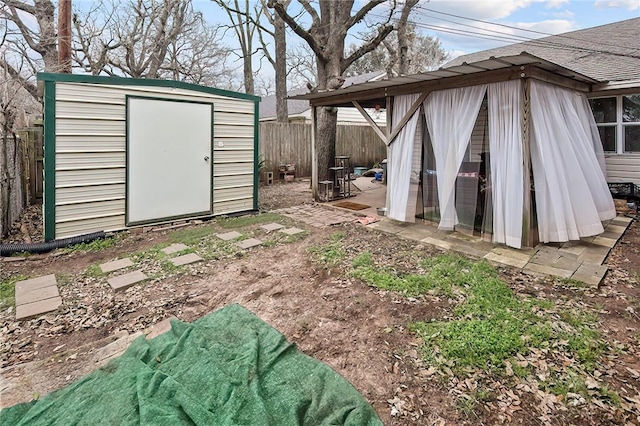 view of shed featuring a fenced backyard