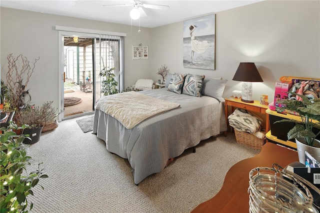 bedroom with access to exterior, light colored carpet, and a ceiling fan