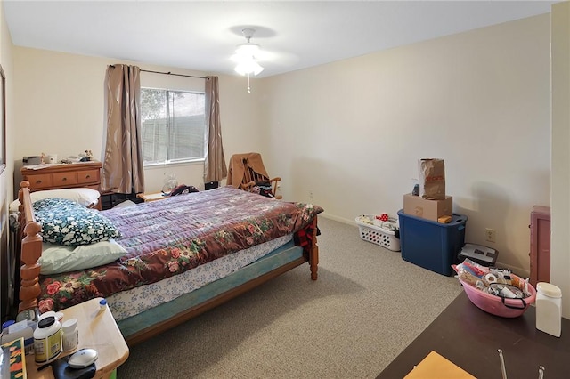 bedroom with carpet flooring and baseboards