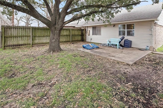 view of yard with a patio area and a fenced backyard