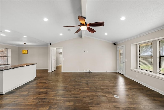 unfurnished living room with lofted ceiling with beams, ornamental molding, and dark wood-type flooring