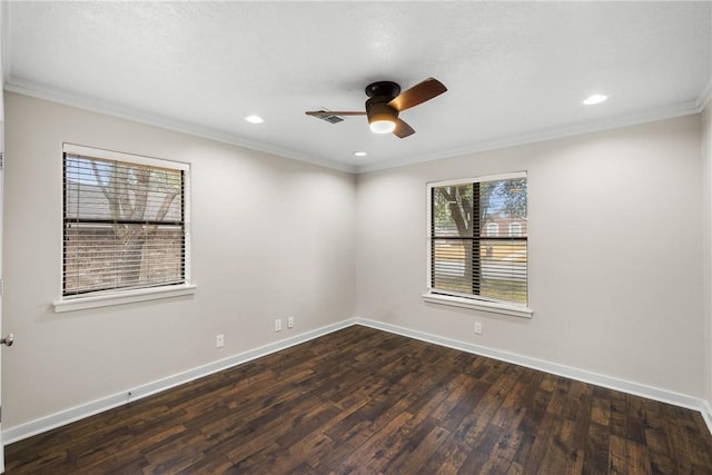 spare room featuring ornamental molding, dark hardwood / wood-style floors, and ceiling fan