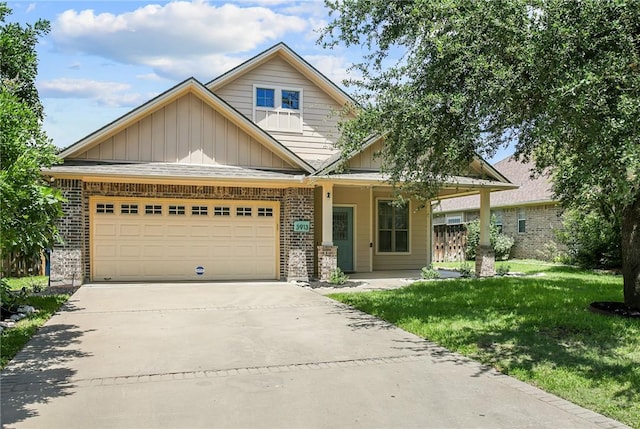 craftsman inspired home featuring a garage and a front yard