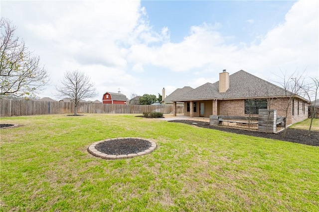 view of yard featuring a patio area and a fenced backyard