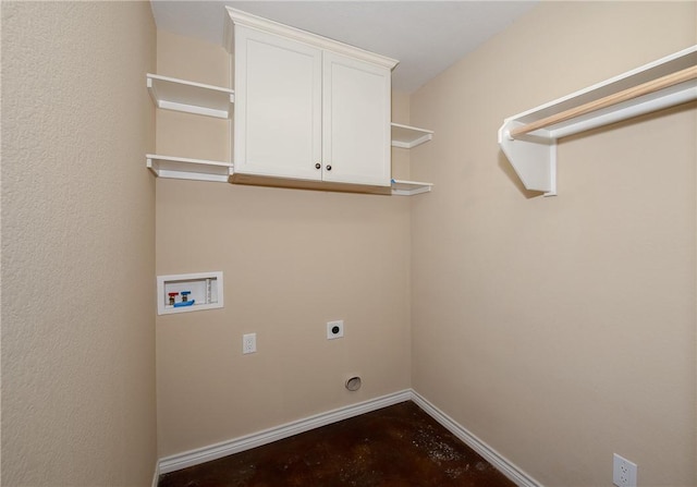 clothes washing area with washer hookup, hookup for an electric dryer, cabinet space, and baseboards