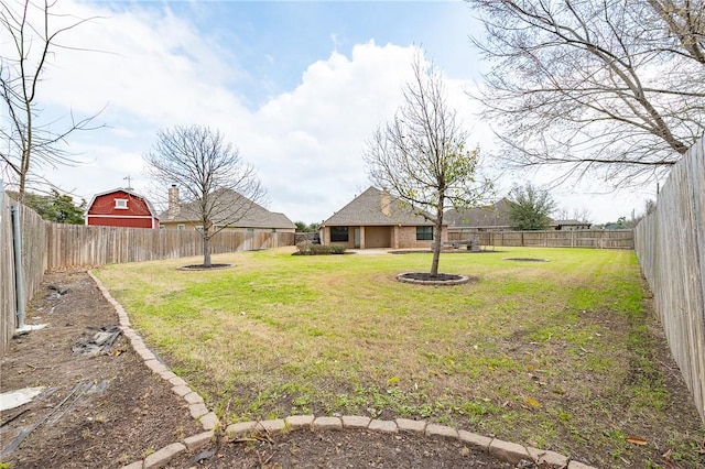 view of yard with a fenced backyard