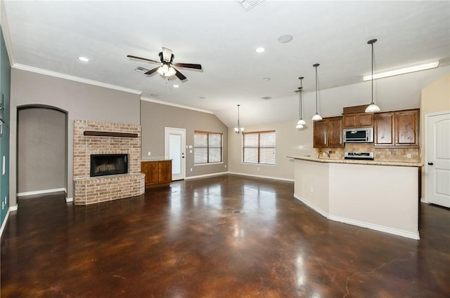 kitchen with baseboards, stainless steel microwave, open floor plan, stove, and concrete flooring