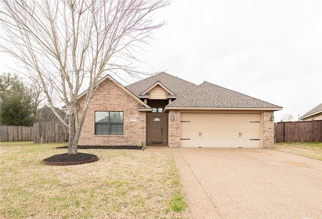 ranch-style home with driveway, an attached garage, fence, a front lawn, and brick siding