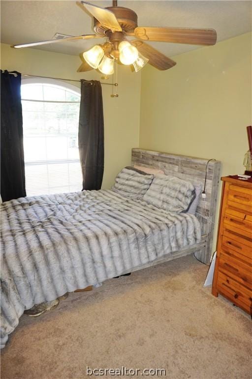 bedroom with ceiling fan and carpet