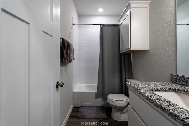 full bathroom featuring toilet, vanity, shower / tub combo, and hardwood / wood-style flooring