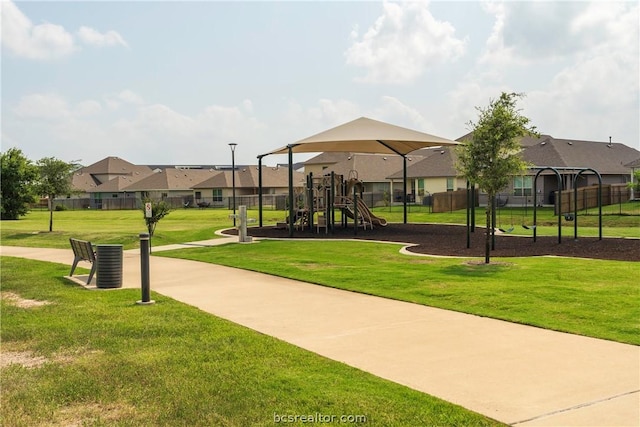 surrounding community with a yard and a playground