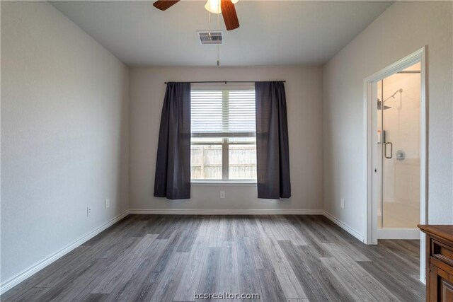 unfurnished room with hardwood / wood-style flooring and ceiling fan