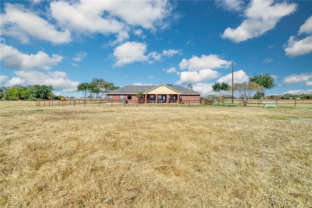 view of yard with a rural view