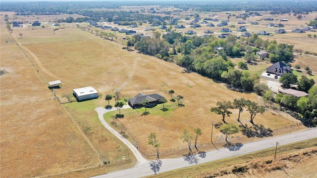 birds eye view of property featuring a rural view