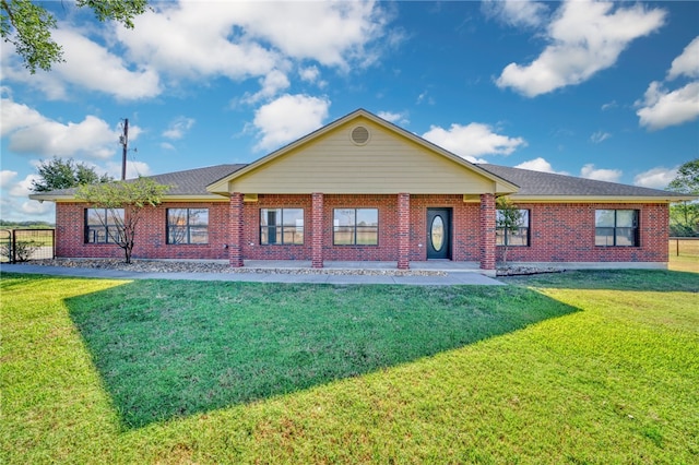 rear view of property with a yard