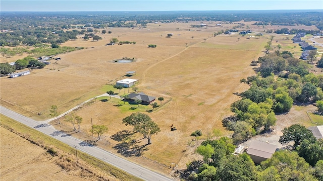 birds eye view of property with a rural view