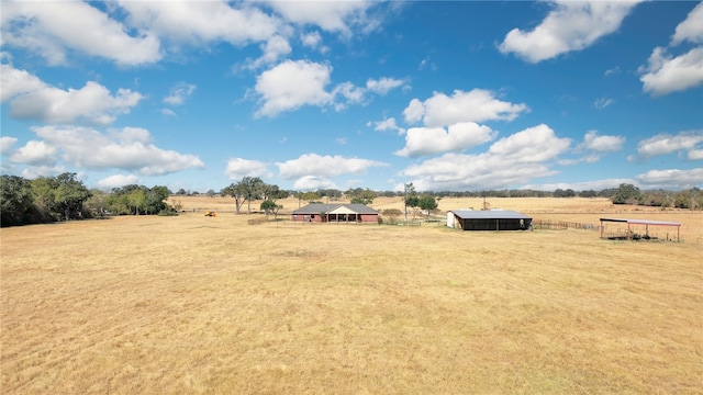 view of yard with a rural view