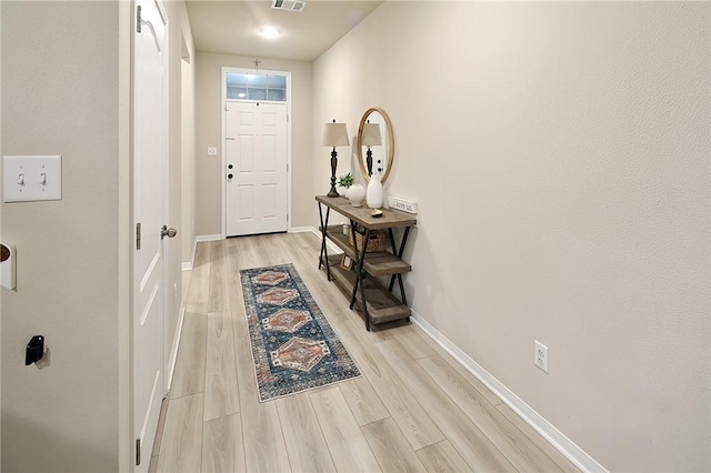 doorway to outside featuring light wood-type flooring