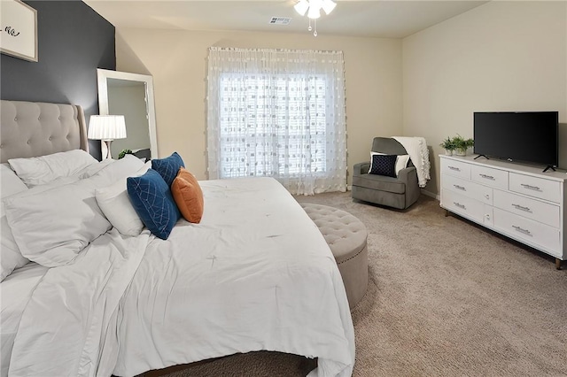 bedroom featuring light carpet