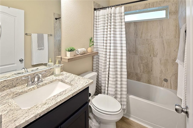 full bathroom with shower / bath combination with curtain, vanity, and toilet