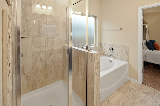 bathroom featuring separate shower and tub