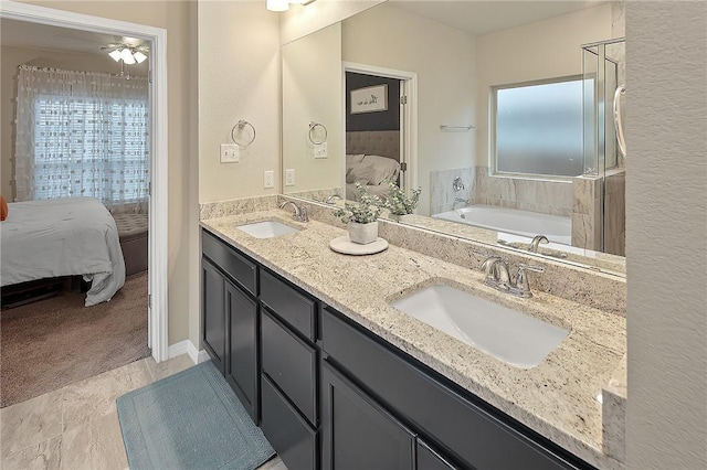 bathroom with a tub to relax in and vanity