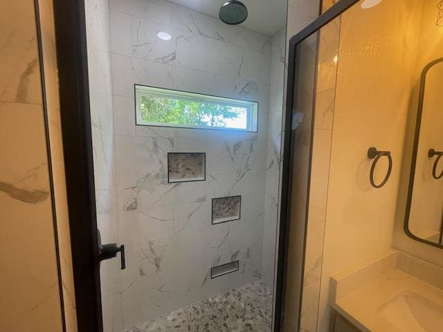 2303 White Wing Dr, Navasota, TX 77868 - bathroom featuring a marble finish shower and vanity