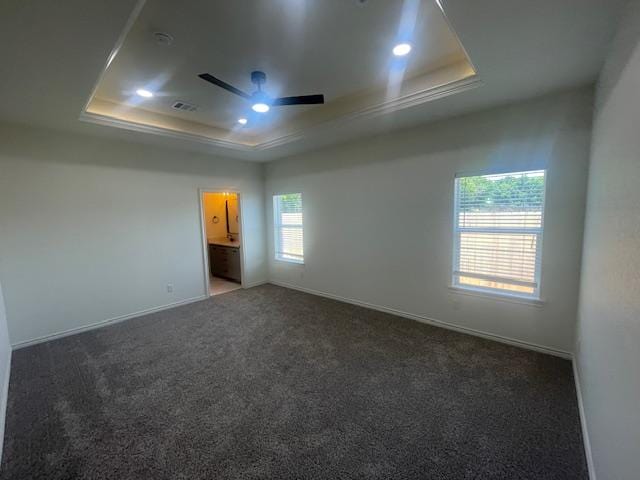 2303 White Wing Dr, Navasota, TX 77868 - spare room featuring a raised ceiling, a ceiling fan, carpet, baseboards, and recessed lighting