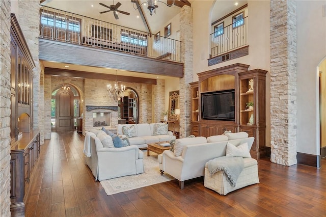 living room featuring ceiling fan with notable chandelier, beamed ceiling, high vaulted ceiling, and dark hardwood / wood-style floors