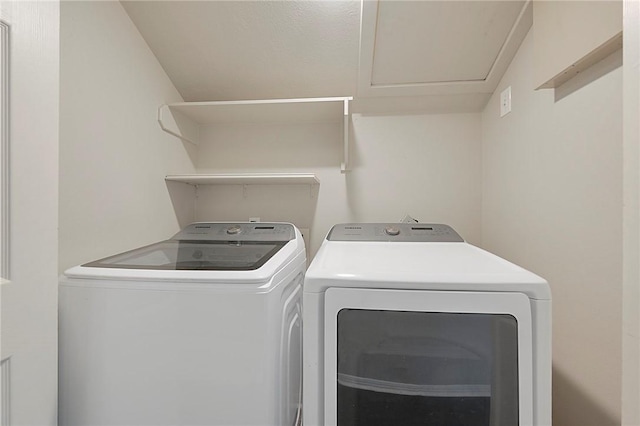 clothes washing area featuring independent washer and dryer