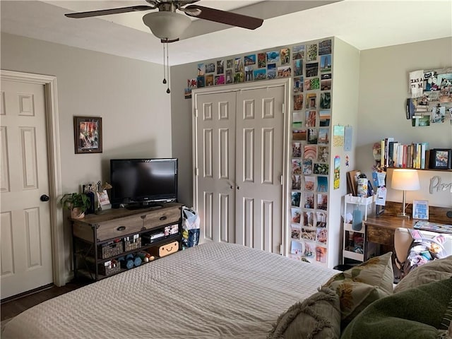 bedroom with ceiling fan and a closet