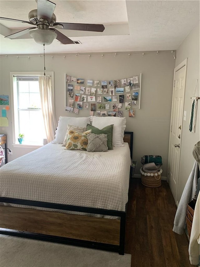 bedroom featuring ceiling fan and dark hardwood / wood-style flooring