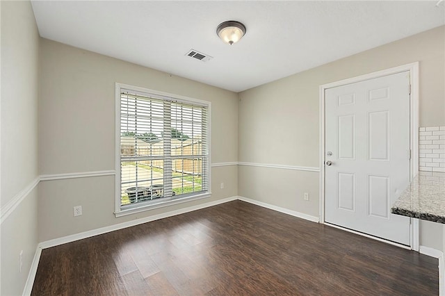 unfurnished room with dark hardwood / wood-style floors