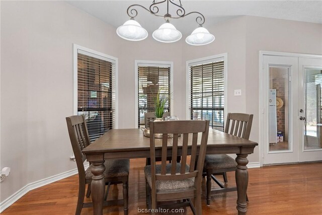 dining space featuring a wealth of natural light and wood-type flooring