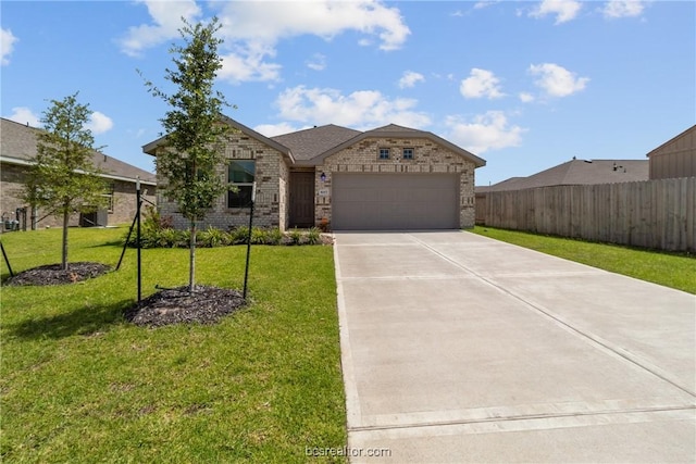 view of front of house with a front lawn and a garage