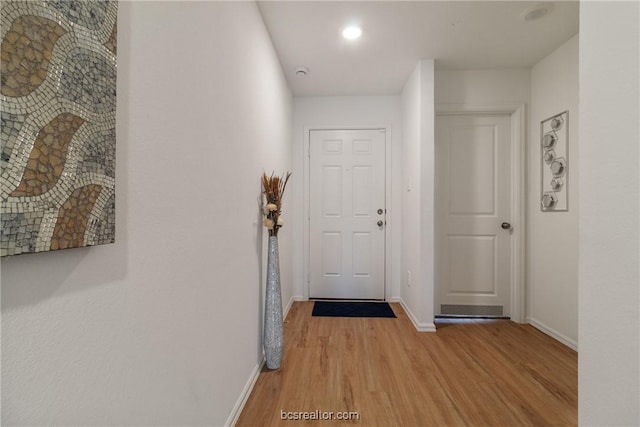 corridor with light wood-type flooring