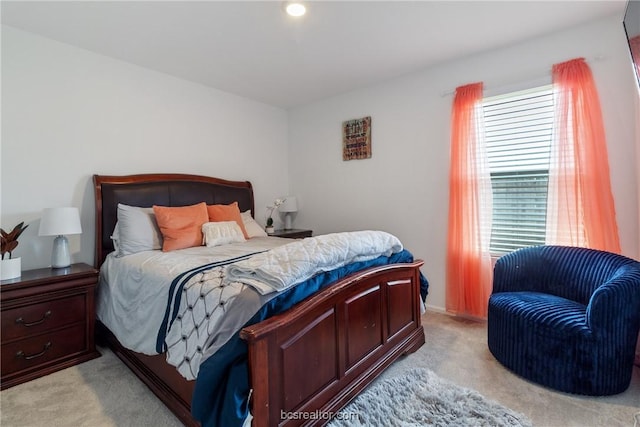 bedroom with light carpet