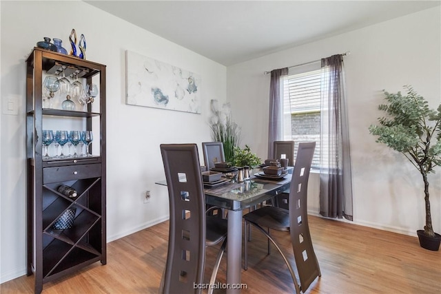 dining area featuring hardwood / wood-style floors