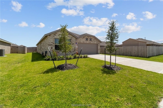 ranch-style home with a garage, a front lawn, and central air condition unit