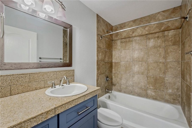 full bath featuring vanity, toilet, and  shower combination